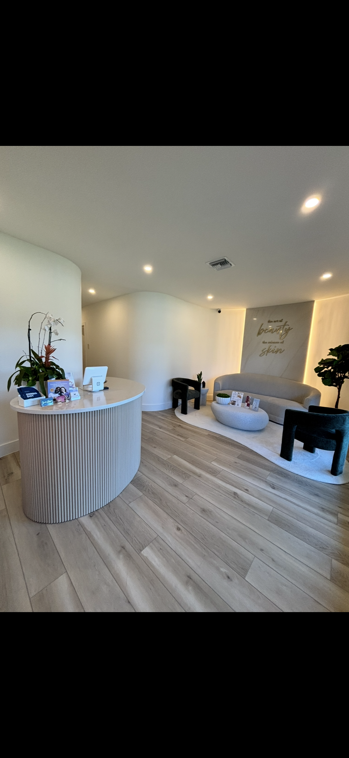 Modern interior design of a living room with a white reception desk.
