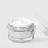 Jar of skincare cream with a white lid on a light gray background